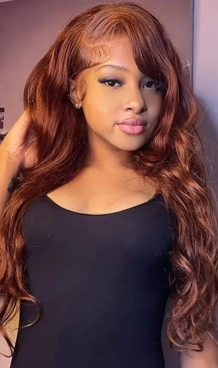 Model wearing Rich Wave – Reddish Brown Body Wave Wig with 13x4 HD lace, styled in soft body wave texture with warm reddish brown color.