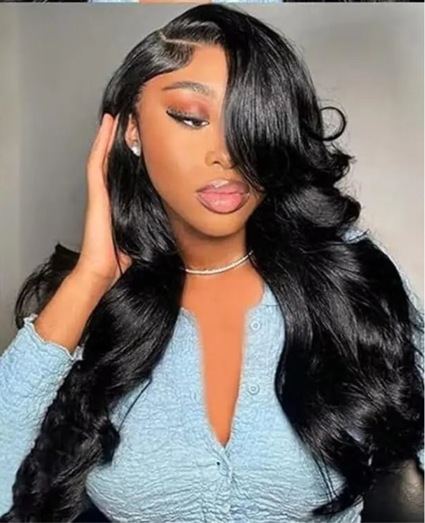 Model wearing Body Wave Wig HD Lace 13x4 – Luxe Extra Long, styled in cascading waves with a flawless lace melt and full bounce.