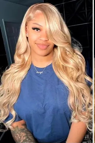 Model wearing Wig Body Wave HD Lace 13x4 – 34 Inch #27 Honey Blonde – Glow Honey, styled in soft waves with radiant color and a flawless lace melt.