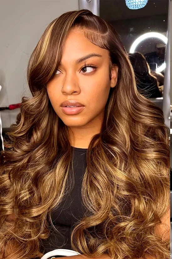Model wearing Body Wave Wig HD Lace 13x6 – 38” Highlight 4/27 – Glow Mode, styled in soft waves with radiant color and a flawless lace melt.