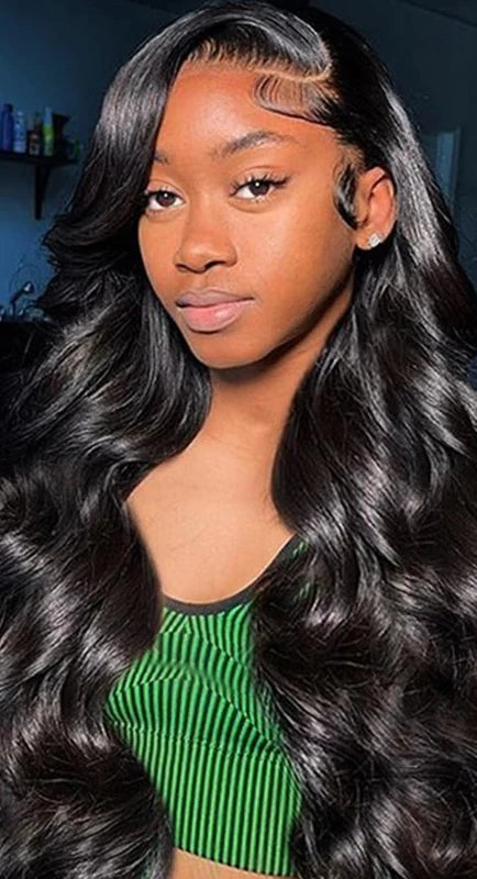 Model wearing Body Wave Wig – Transparent Lace 13x4 – Natural – Main Character, styled with seamless lace and soft glam texture.