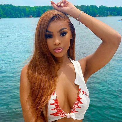 Model wearing ginger blonde straight wig with 13x6 HD lace frontal, warm spiced tone and sleek finish.

