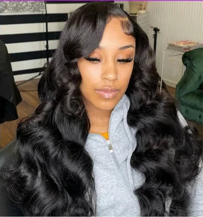 Model wearing Body Wave Wig HD Lace 13x6 – Natural Black – Laid Flow, styled in soft waves with seamless lace melt.