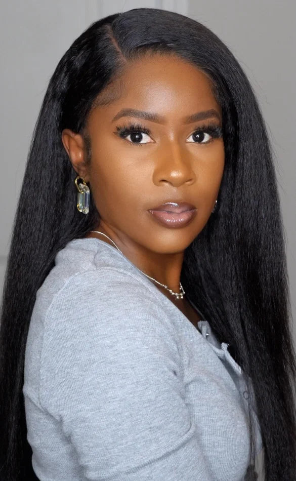 Model wearing Soft Yaki – Kinky Straight Wig with Swiss lace, styled in soft yaki texture with natural hairline.