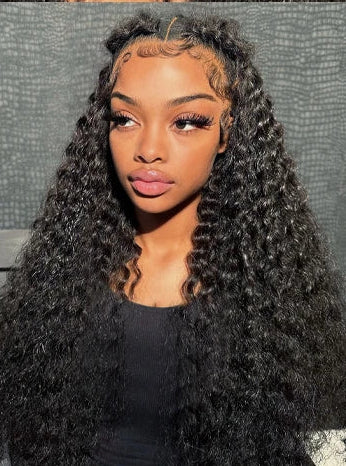 Model wearing The Loose Melt – Deep Wave Wig with 13x4 HD lace, styled in loose waves with natural hairline.