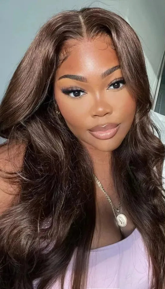 Model wearing Wig Body Wave HD Lace 13x4 – 34 Inch Chocolate Brown – Glow Cocoa, styled in soft waves with rich chocolate tone and transparent lace.