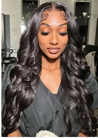 Model wearing Wig Body Wave HD Lace 13x6 – 1B Natural – Velvet Current, styled in soft waves with transparent lace and natural black tone.

