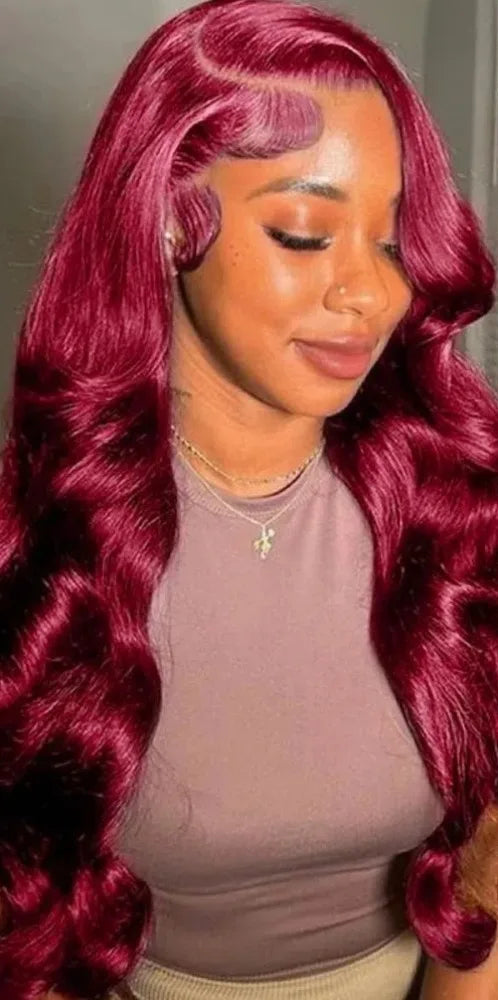 Model wearing wine  burgundy body wave wig with 13x6 HD lace and sculpted waves